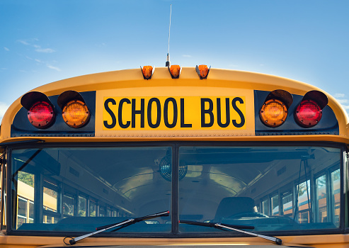 Front closeup view of a yellow school bus