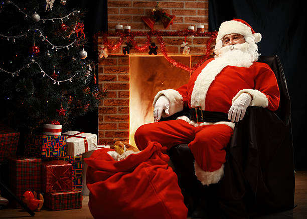 istock Santa Claus having a rest in a comfortable chair 495470382