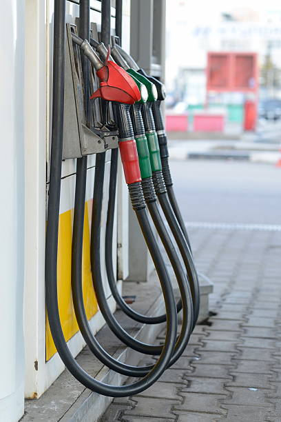 istock Fuel nozzles at a gas station. 495470488