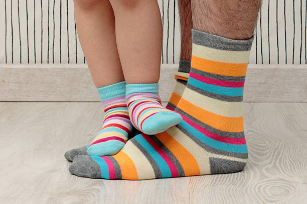 istock father and son in socks 495470923