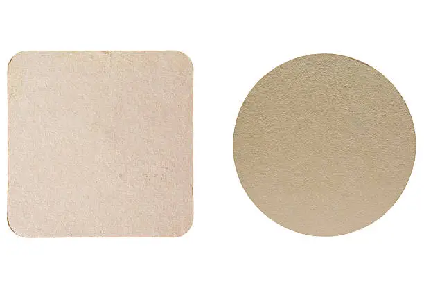 Square and round blank cardboard beermat for a pint of beer isolated over white background
