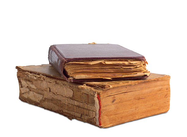 istock stack of old books with gold stamping on  white background 495471311