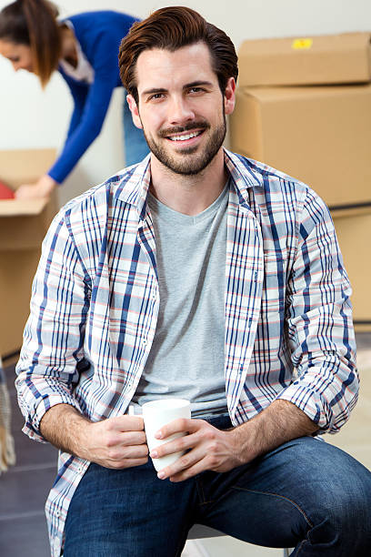 istock Young couple moving in new home 495472013