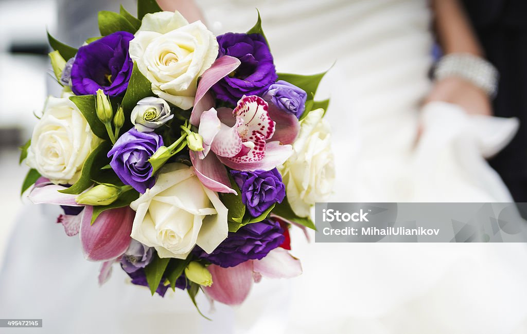 Wedding bouquet with different flowers in hands of bride Bouquet Stock Photo