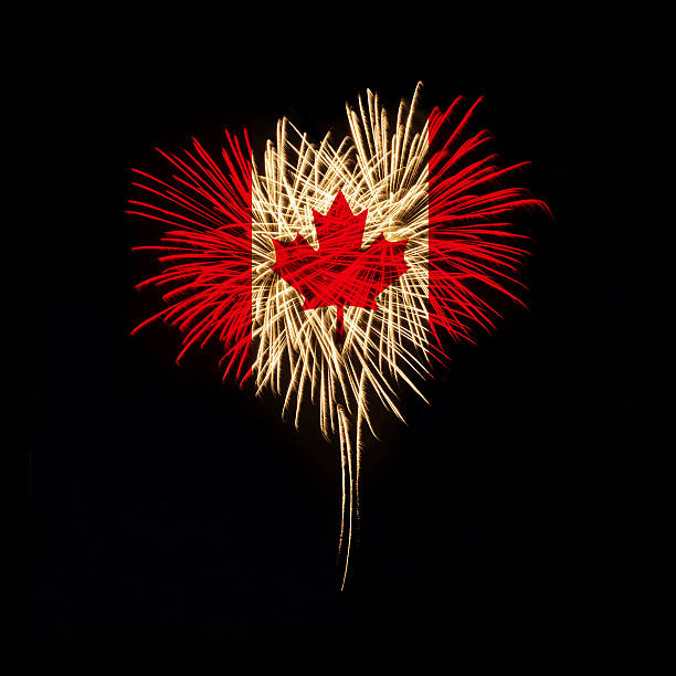 Canada day. Welcome to Canada Fireworks in a heart shape with the Canada flag on a black background. Canada day. Welcome to Canada canada day photos stock pictures, royalty-free photos & images