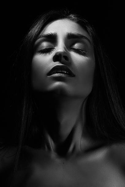 aroused woman sensual aroused woman in dark monochrome orgasm women female sexual issues stock pictures, royalty-free photos & images