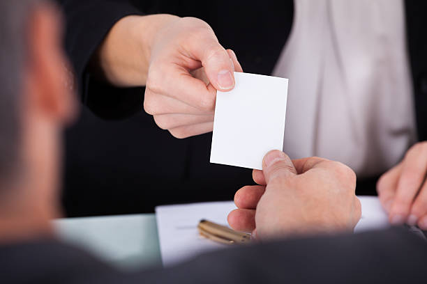 istock Businesspeople Exchanging Visiting Card 495472897