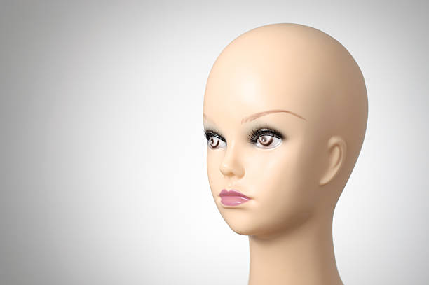 Black and white image of an eyeless mannequin.