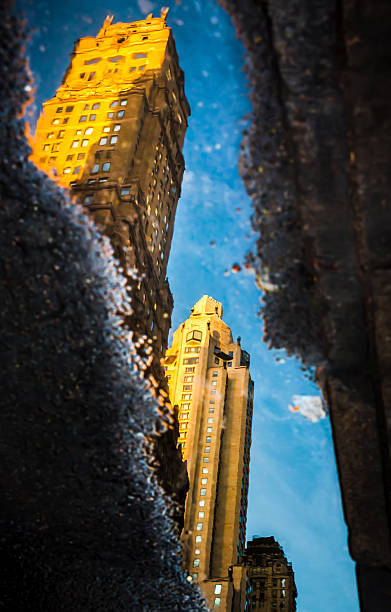 istock Streets of Manhattan. Skyscrapers reflection in puddles 495473198