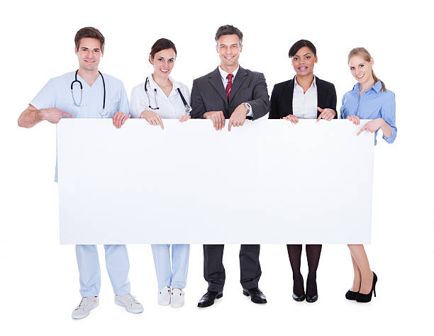 istock Doctors And Businesspeople With Billboard 495474363