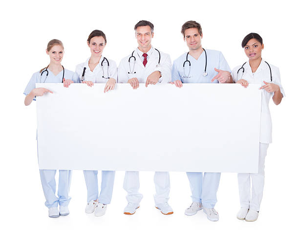 istock Group Of Doctors With Blank Billboard 495474375