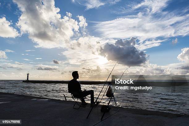 Fishing On Coast At Sunset Time Stock Photo - Download Image Now - Fishing,  Night, Sea - iStock