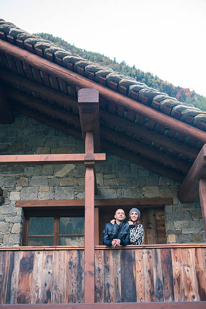 istock young couple embracing on the mountain house balcony 495481602