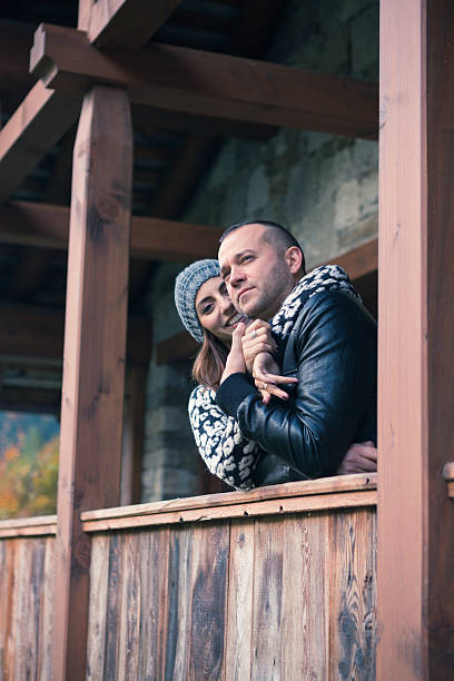 istock young couple embracing on the mountain house balcony 495481936