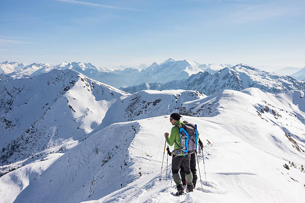 istock Mountaineer on snow-covered mountain ridge at high altitude 495482600