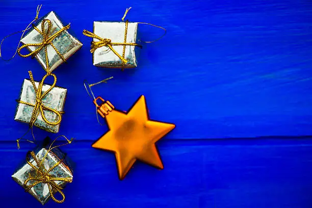 Photo of Christmas Symbols and Tree Decorations such as Boxes of Presents