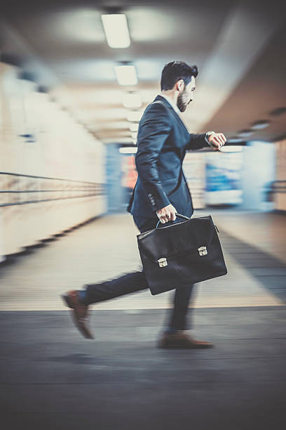 istock Businessman with briefcase running  late for a meeting 495483460