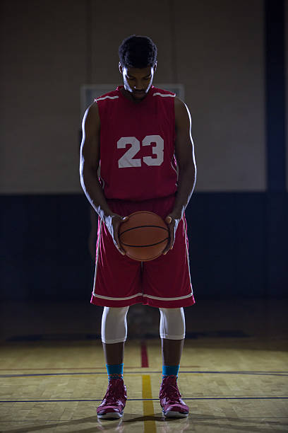 istock Young men playing basketball in a gymnasium 495490830