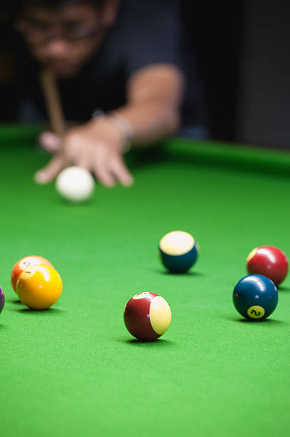 istock Snooker player placing the cue ball for a shot 495493270
