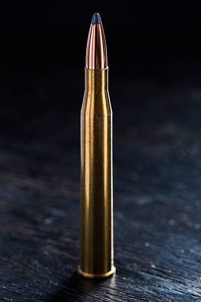 istock Large-caliber cartridge on a dark background 495493376