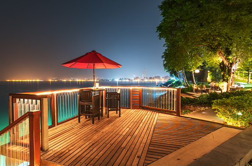 Open air cafe bar on the sea view terrace in night