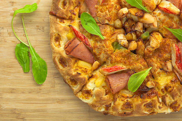 istock Hot Pizza with Pineapple, Ham and Bell Pepper Top View 495495522