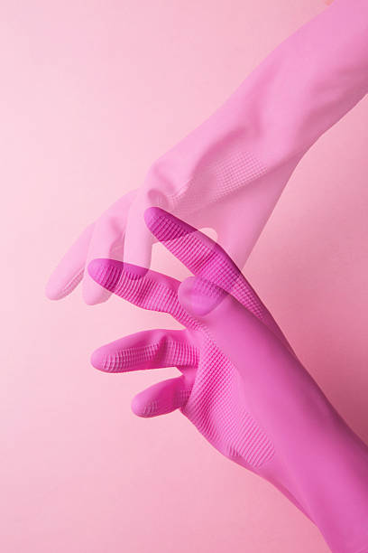 istock hand with pink rubber glove 495496562