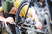 Man repairing bike.