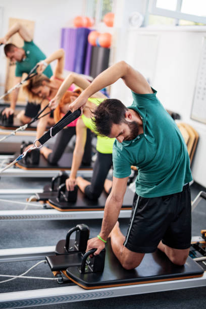 istock Exercise class on Pilates machines in a health club. 495506244