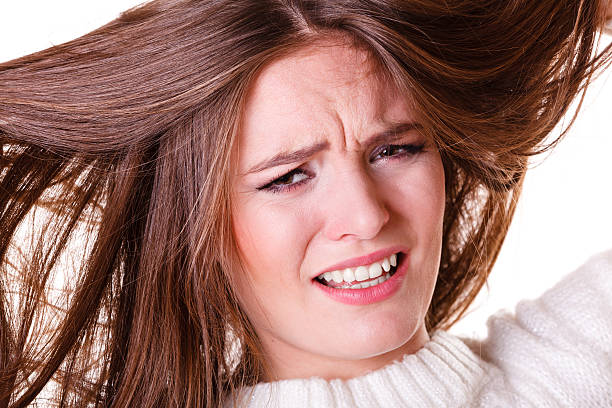 istock Woman pulls hair being sad. 495507250