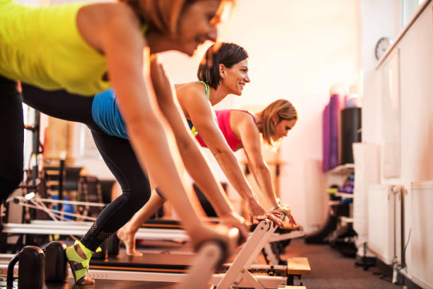 istock Group of happy women exercising on Pilates training class. 495507836