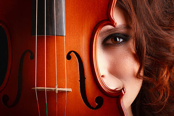 istock Beautiful young girl with violin 495508911