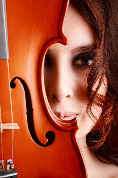 istock Beautiful young girl with violin 495509333