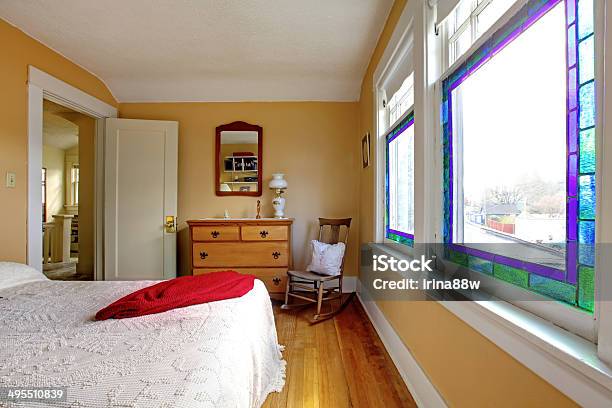 Yellow Bedroom With White Bed And Wood Dresser Stock Photo - Download Image Now - Apartment, Bed - Furniture, Bedding