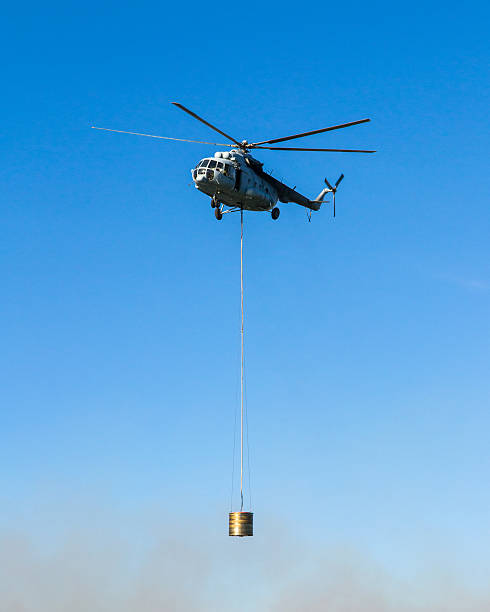 istock Helicopter in action carrying the water bucket 495512167