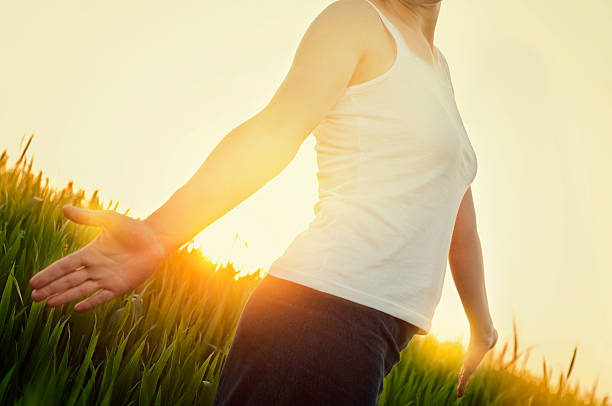 Young woman relaxing in a meadow stock photo