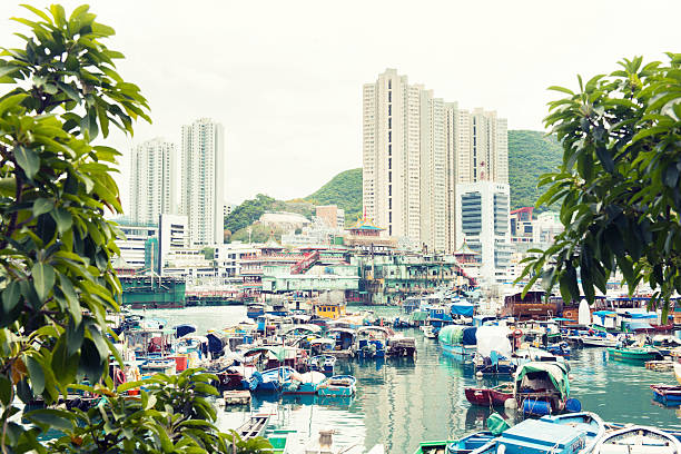Traditional Boats Docked in Aberdeen Harbour Hong Kong This is a color photograph of boats in Aberdeen Harbour Hong Kong. aberdeen hong kong photos stock pictures, royalty-free photos & images