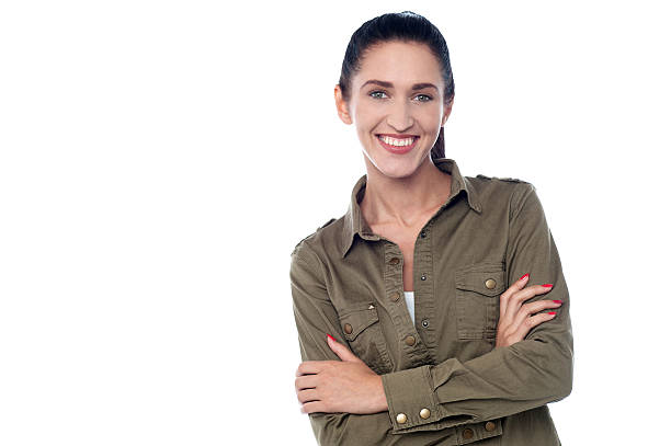 istock Young woman standing with arms crossed 495512959
