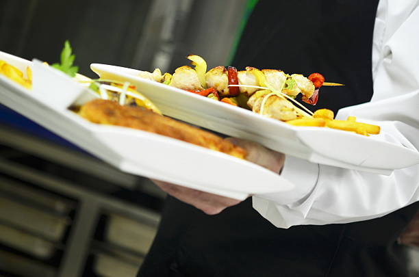istock male chef presenting food 495513161