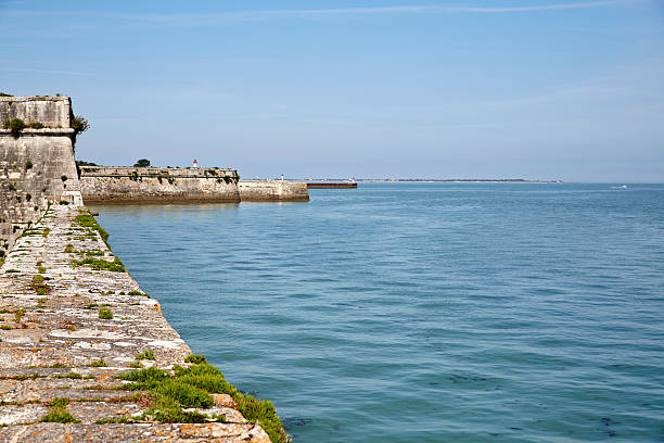 istock Coastal wall and lighthouse on Ile De Re 495518146