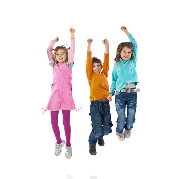 istock Happy children jumping with their arms raised. 495519226