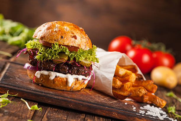 istock Delicious hamburger on wood 495519930