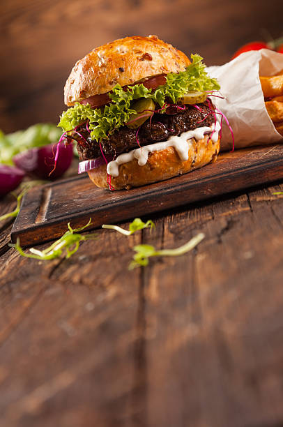 istock Delicious hamburger on wood 495519950