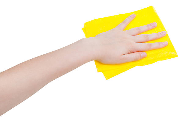 istock hand with yellow wiping rag isolated on white 495520024
