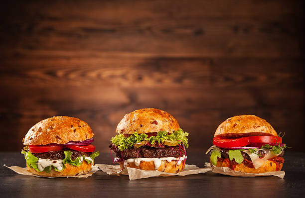 istock Delicious hamburgers on wood 495520154