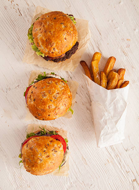 istock Delicious hamburgers on wood 495520370