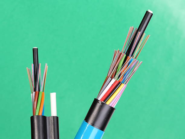 Two fiber optic loose tube cables with exposed optical fibers Two fiber optic loose tube cables with stripped ends and bare exposed colored optical fibers, Australia 2015 broadband isp stock pictures, royalty-free photos & images