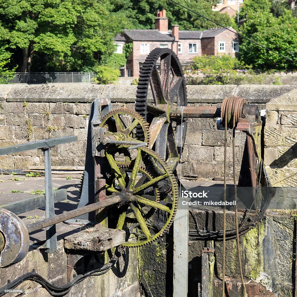 Sluice gate gears Winding gear on a slice gate at the weirs on the River Derwent at Belper Gear - Mechanism Stock Photo