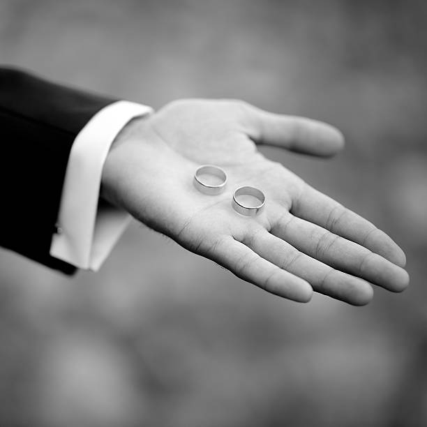 istock Groom with wedding rings on hand. 495536154