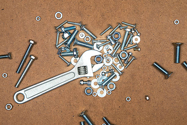 istock Bright heart with wrench from bolts and nuts 495537470